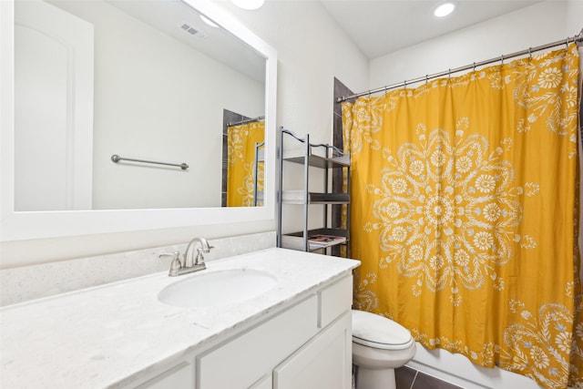 full bathroom featuring shower / tub combo, vanity, and toilet