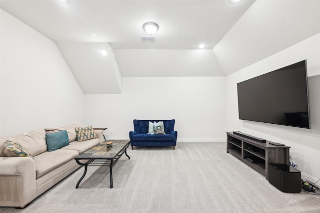 carpeted living room featuring lofted ceiling