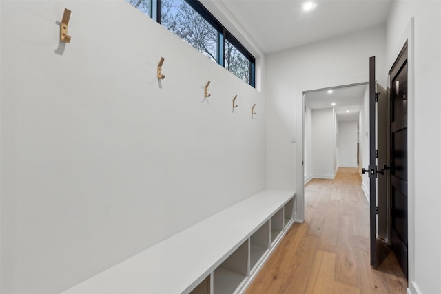 mudroom with light hardwood / wood-style flooring