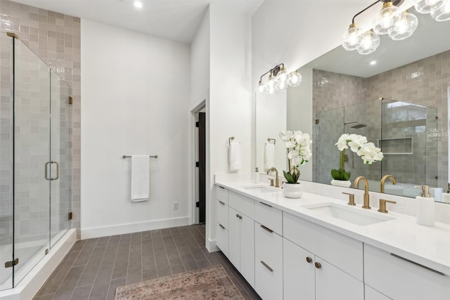 bathroom featuring vanity and an enclosed shower