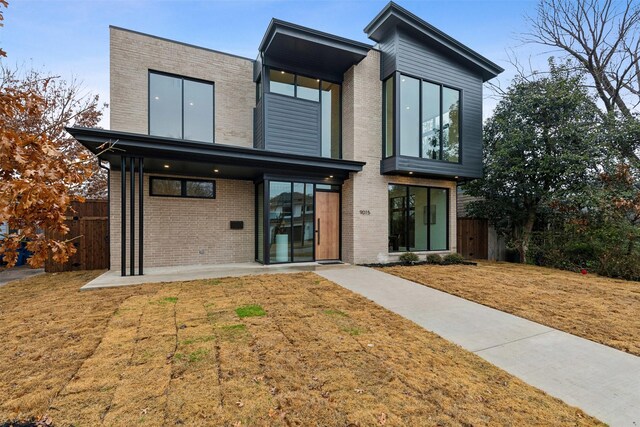 view of exterior entry with brick siding