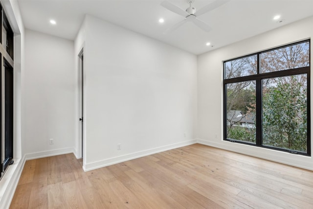 empty room featuring ceiling fan and light wood-type flooring