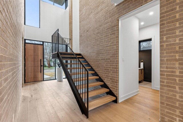 office with a healthy amount of sunlight, recessed lighting, and wood finished floors
