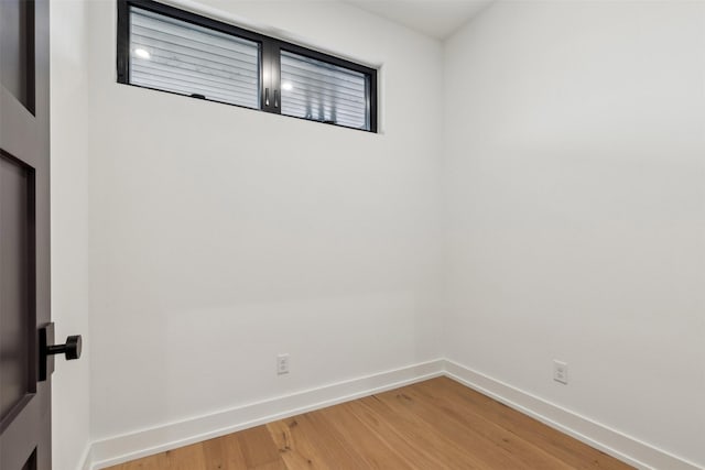 unfurnished room featuring hardwood / wood-style floors