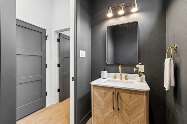 bathroom featuring vanity and wood-type flooring