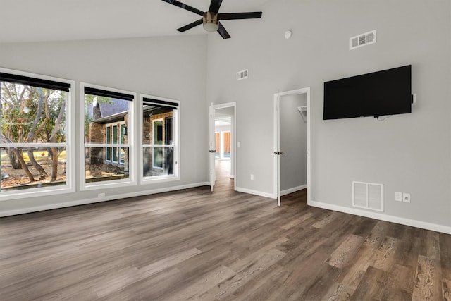 unfurnished living room with hardwood / wood-style floors, high vaulted ceiling, and ceiling fan