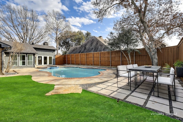 view of pool featuring a lawn, an outdoor structure, and a patio