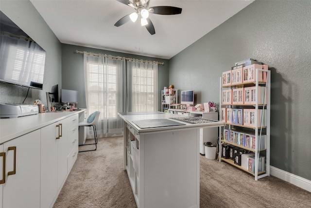 office with ceiling fan and light colored carpet