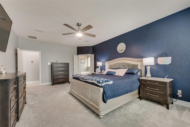 bedroom featuring light colored carpet and ceiling fan