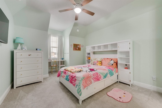 bedroom with lofted ceiling, light colored carpet, and ceiling fan