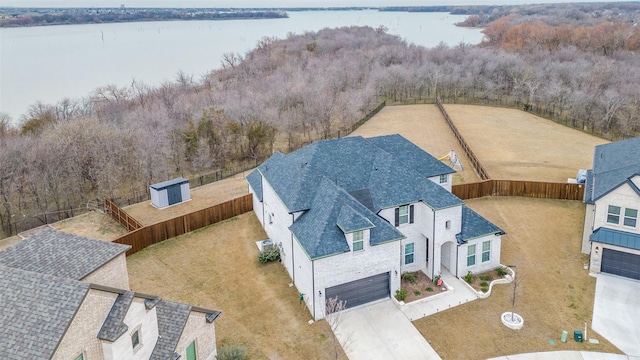 birds eye view of property featuring a water view