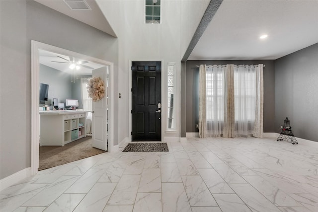 entryway featuring ceiling fan