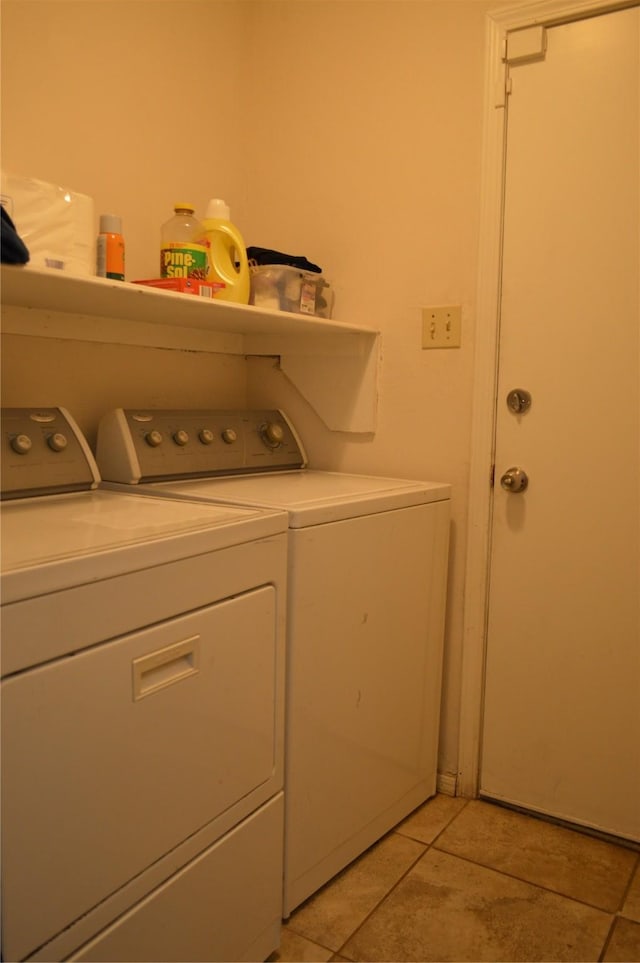 washroom with light tile patterned floors and independent washer and dryer