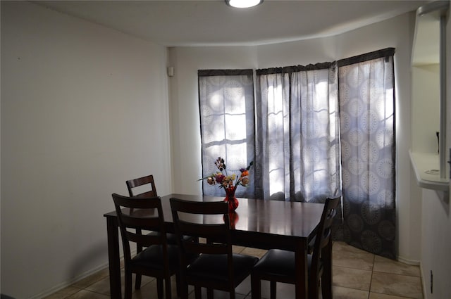 dining room featuring light tile patterned flooring