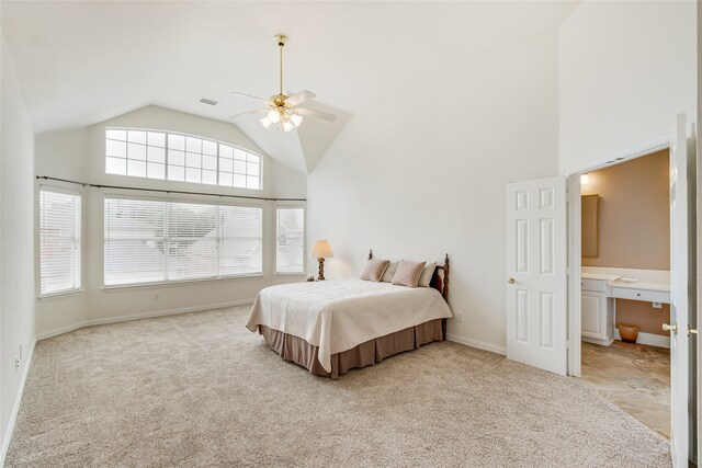 carpeted bedroom with high vaulted ceiling and ceiling fan