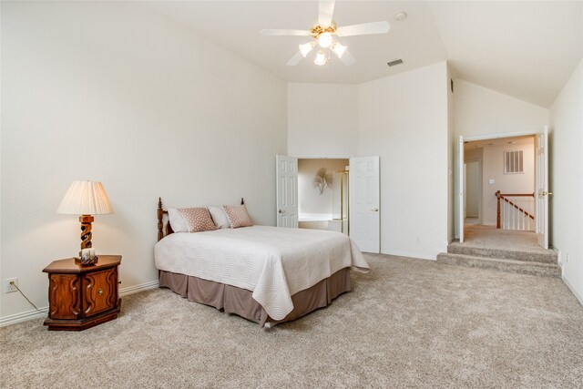 carpeted bedroom featuring high vaulted ceiling and ceiling fan