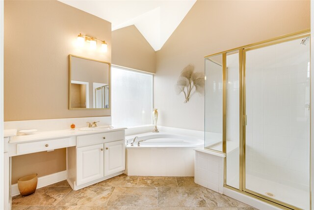 bathroom with vanity and separate shower and tub