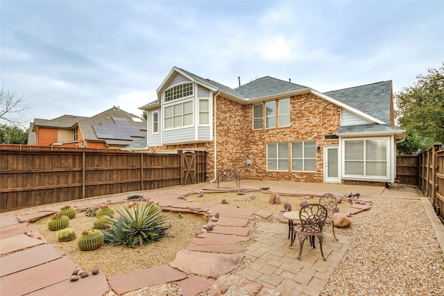 back of house with a patio area