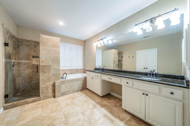 bathroom featuring vanity, independent shower and bath, and tile patterned flooring