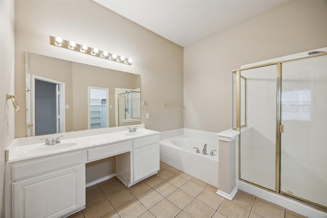 bathroom featuring tile patterned floors, shower with separate bathtub, and vanity