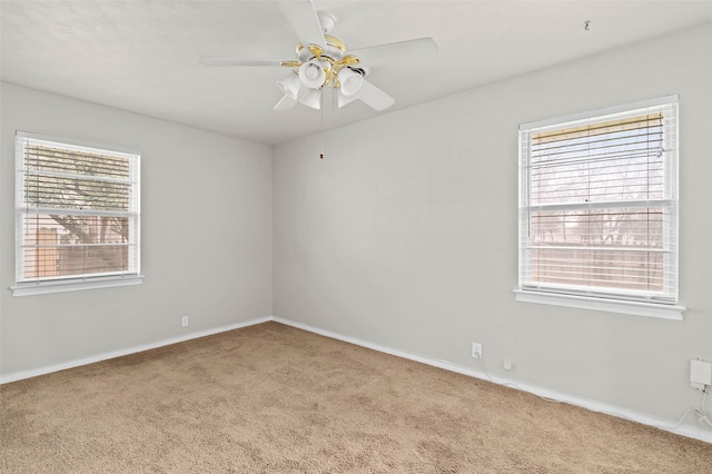 unfurnished room featuring ceiling fan and carpet flooring