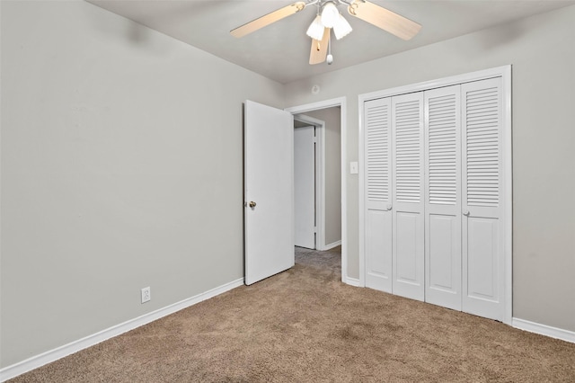 unfurnished bedroom with a closet, ceiling fan, and carpet