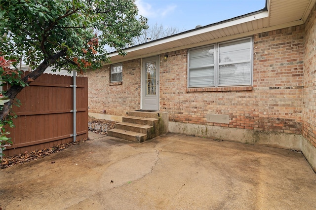 property entrance with a patio