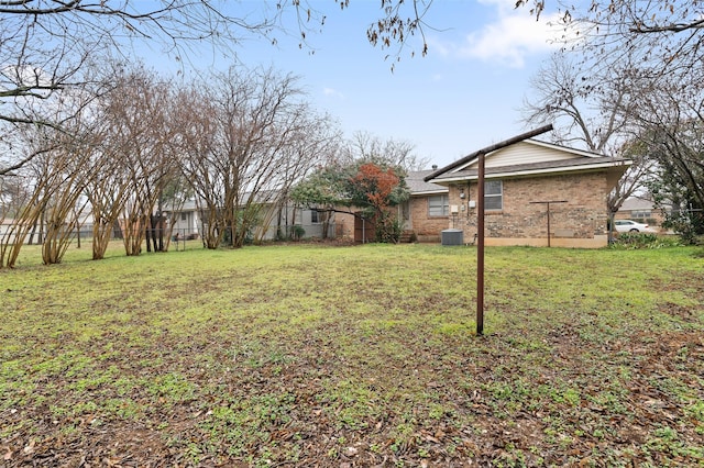 view of yard featuring central air condition unit