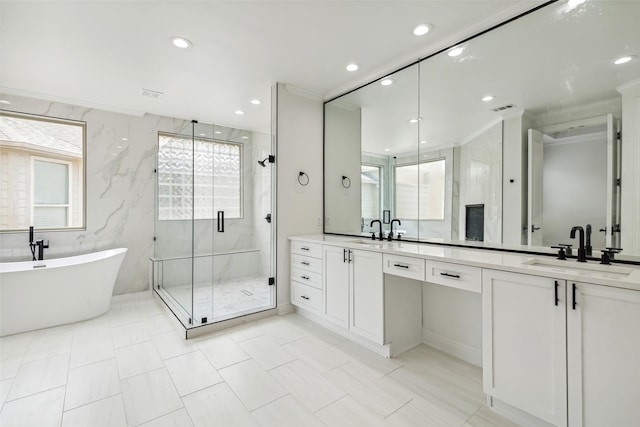 bathroom with vanity and separate shower and tub