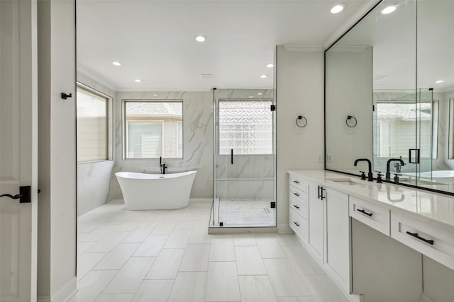 bathroom with independent shower and bath, vanity, and ornamental molding