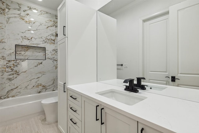 full bathroom with vanity, crown molding, toilet, and tiled shower / bath