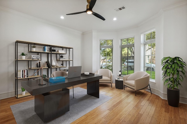 home office with hardwood / wood-style flooring, ornamental molding, and ceiling fan