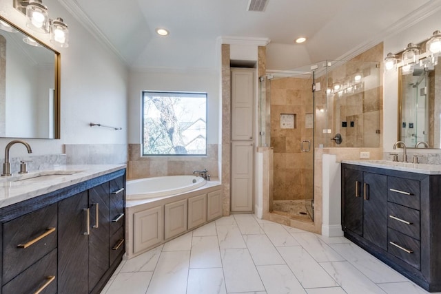 bathroom with crown molding, vanity, and shower with separate bathtub