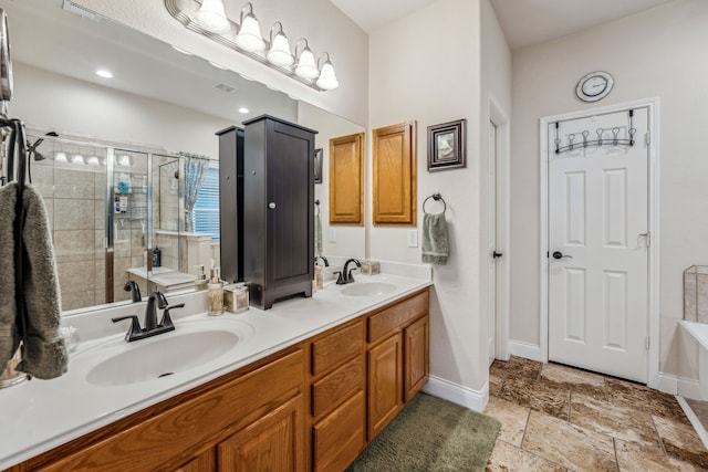 bathroom featuring vanity and shower with separate bathtub