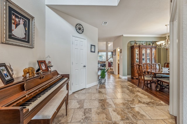 foyer entrance with an inviting chandelier