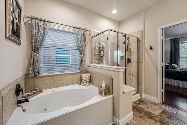 bathroom with shower with separate bathtub