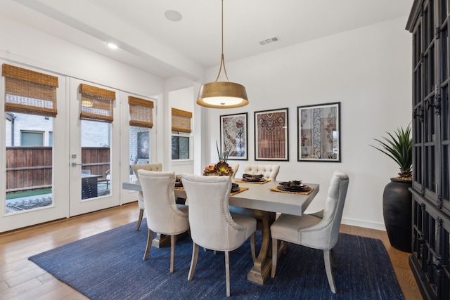 dining room with hardwood / wood-style floors