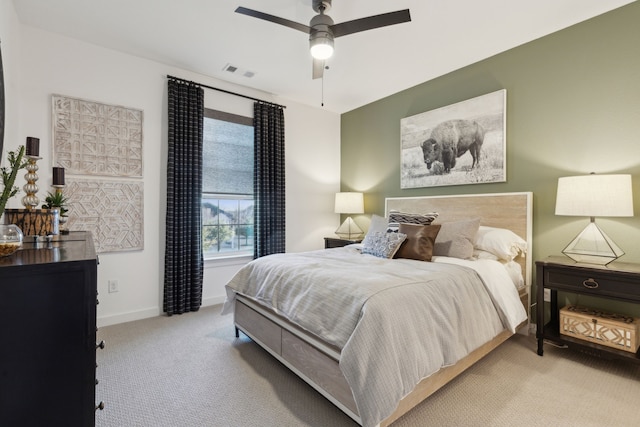 bedroom featuring ceiling fan and light carpet