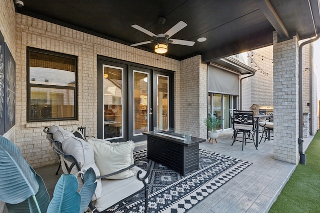 view of patio / terrace with an outdoor living space and ceiling fan