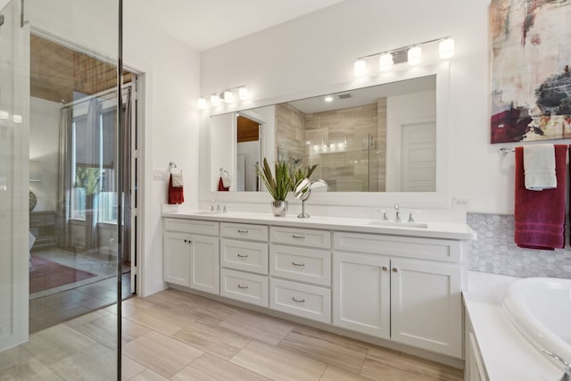 bathroom featuring vanity and plus walk in shower