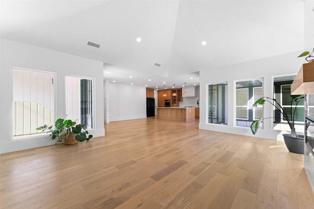 unfurnished living room featuring light hardwood / wood-style floors