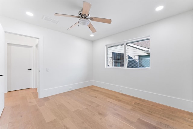 empty room featuring ceiling fan and light wood-type flooring