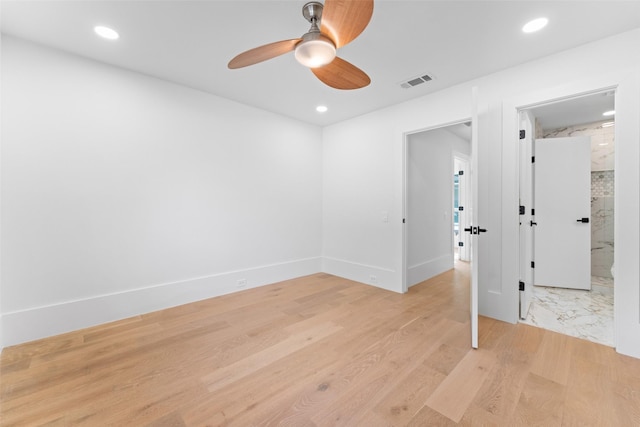 unfurnished room featuring light hardwood / wood-style flooring and ceiling fan