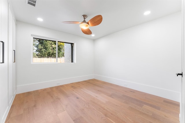 unfurnished room with ceiling fan and light wood-type flooring