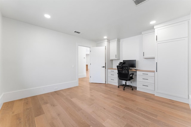 unfurnished office with light wood-type flooring