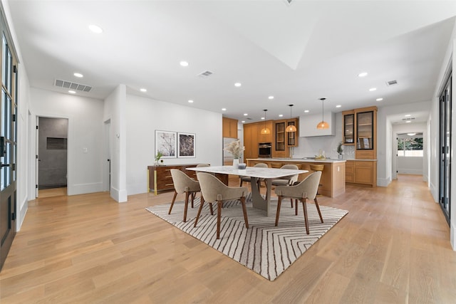 dining area with light hardwood / wood-style floors