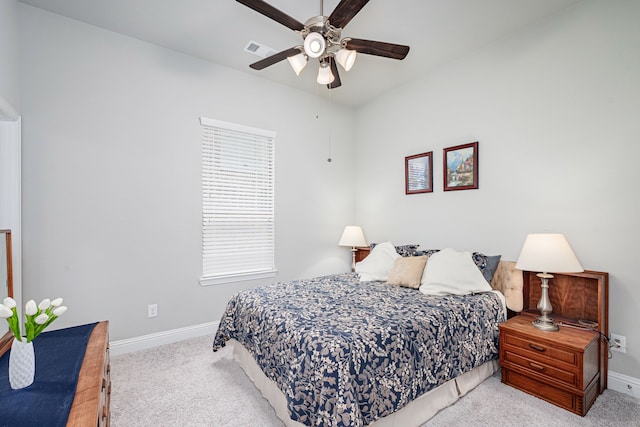 bedroom featuring ceiling fan and light colored carpet