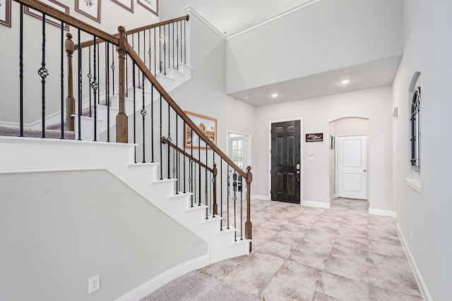 foyer featuring a high ceiling