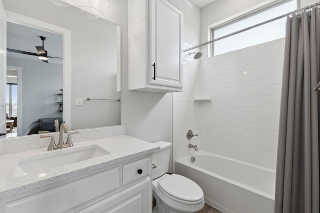 bathroom featuring toilet, shower / bathtub combination with curtain, and vanity