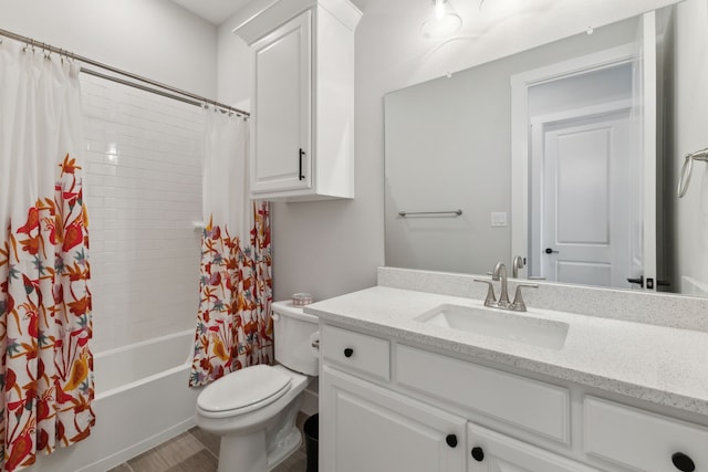 full bath with toilet, shower / tub combo with curtain, and vanity